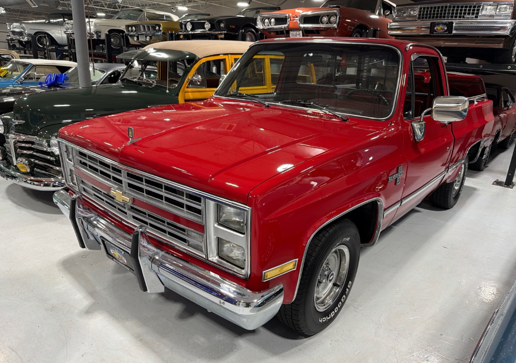 Red 1987 Chevrolet C10 Silverado pickup transported by Allstar Hauling