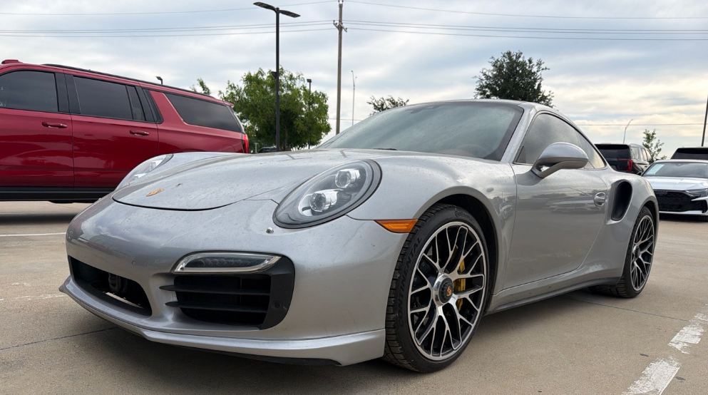 Silver Porsche 911 Turbo S transported by Allstar Hauling