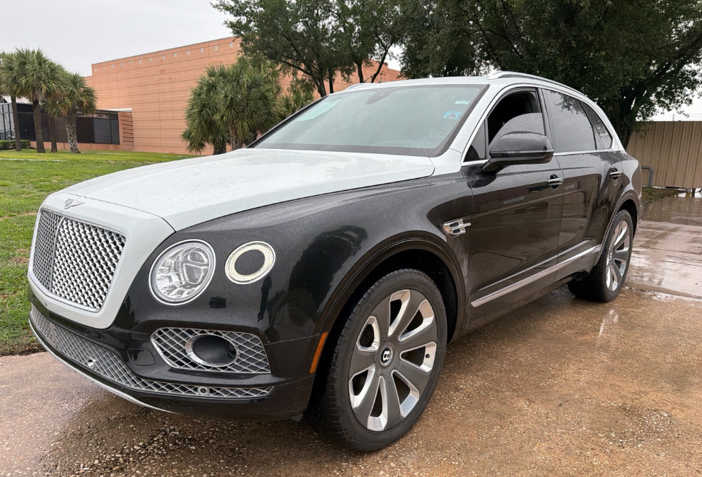 Black and silver Bentley Bentayga hauled by Allstar Hauling