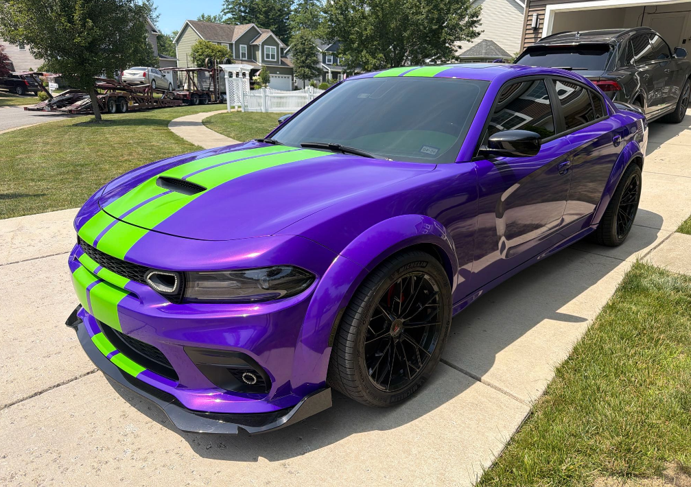 Purple Dodge Charger Hellcat Widebody with green stripes hauled by Allstar Hauling