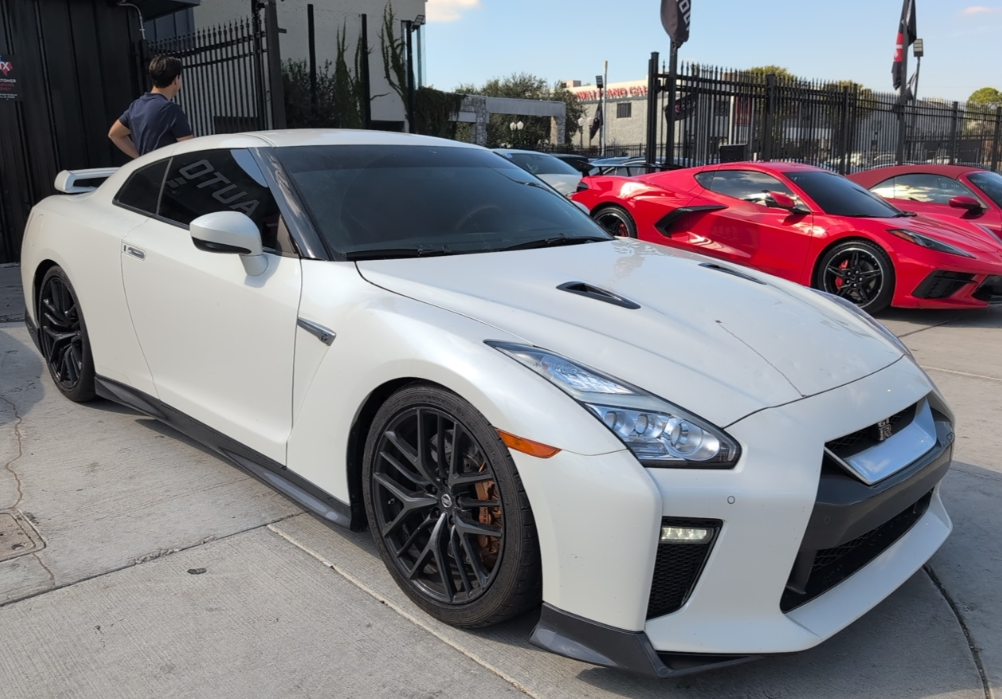 White Nissan GT-R transported by Allstar Hauling
