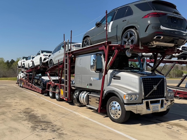 Mercedes-Benz SUV loaded on an Allstar Hauling Volvo VHD carrier